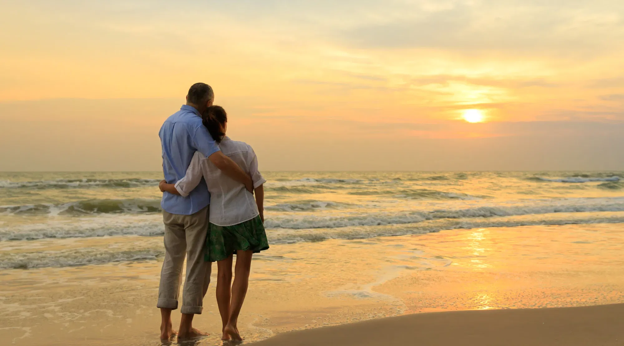 Romantic moment on the beack watching the sunset
